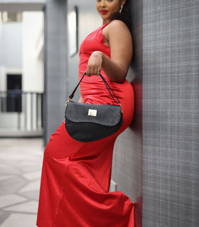 Denri Africa's black Montana Sling Bag. Classic everyday black sling purse, modern styling, compact form.