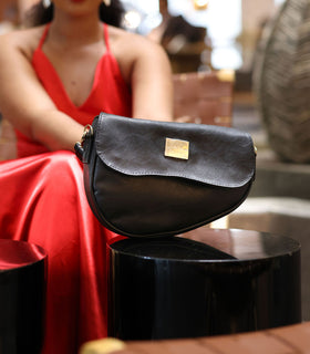 Denri Africa's black Montana Sling Bag. Timeless black sling, compact and practical, vegan leather build.