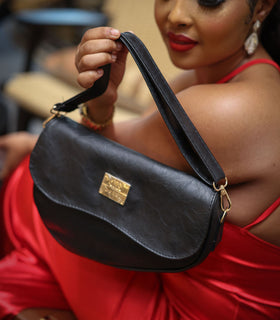 Denri Africa's black Montana Sling Bag. Elegant black crossbody sling, sleek vegan leather