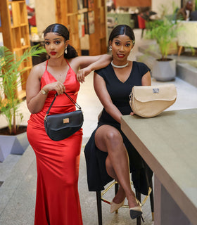 Denri Africa's black and beige Montana Sling Bags. Dual-tone display set, vegan leather slings for everyday use.