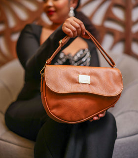 Denri Africa's spice Montana Sling Bag. Deep spice sling, portable crossbody bag, everyday use.