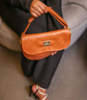 Denri Africa's spice Montana Sling Bag. Warm earthy sling bag, compact vegan leather carry.