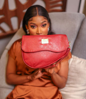 Denri Africa's red Montana Sling Bag. Trendy crossbody sling, bright red finish, compact everyday carry.