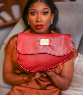 Denri Africa's red Montana Sling Bag. Chic red mini sling, durable vegan leather, perfect for errands and casual outings.