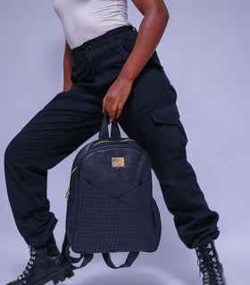 Denri Africa's black Monah Backpack. Sleek black school backpack, durable fabric, ideal for daily commute or classes.