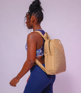 Denri Africa's beige Monah Backpack. Beige all‑purpose backpack, large storage compartments, ideal for students or travelers.