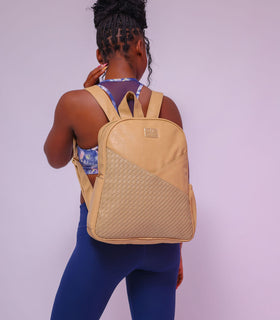 Denri Africa's beige Monah Backpack. Minimalist beige backpack, water‑resistant, practical for urban use or daily commute.
