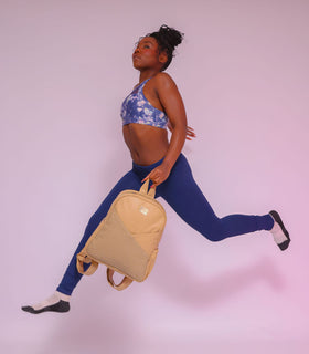 Denri Africa's beige Monah Backpack. Beige commuter backpack, smooth fabric finish, good for work, school or travel.