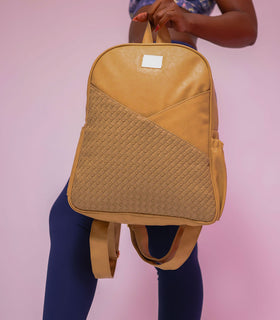 Denri Africa's beige Monah Backpack. Neutral-tone beige bag, roomy interior, comfortable padded straps for daily wear.