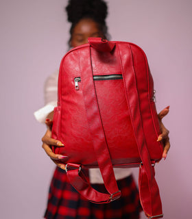 Denri Africa's red Monah Backpack. Stylish red backpack, ergonomic design, suitable for commuting, school or work.