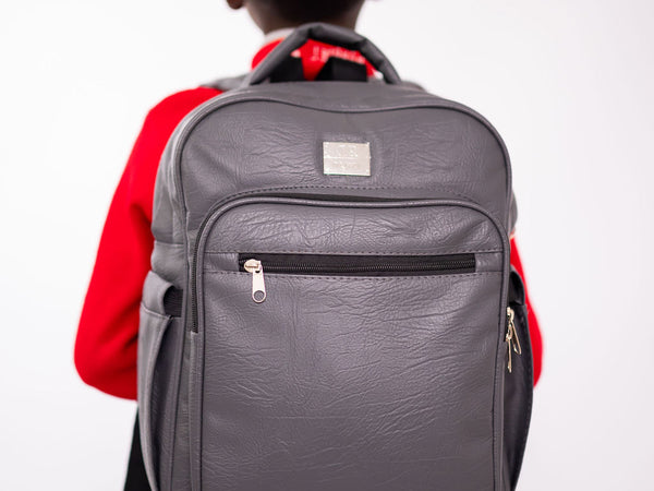 Denri Africa's gray Pioneer Backpack. Gray multipurpose backpack, water-resistant outer fabric, school or travel use.