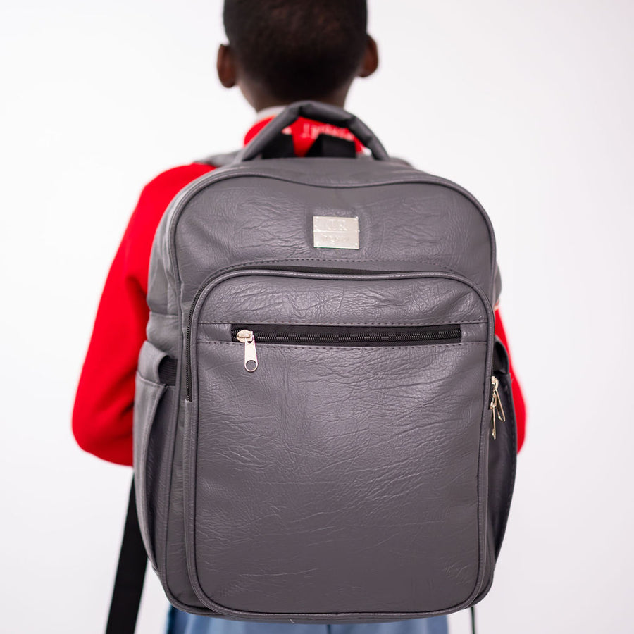 Denri Africa's gray Pioneer Backpack. Gray multipurpose backpack, water-resistant outer fabric, school or travel use.