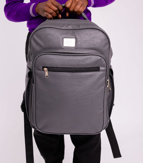 Denri Africa's gray Pioneer Backpack. Functional gray backpack, sturdy construction, ideal for students and travelers.