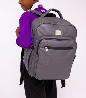 Denri Africa's gray Pioneer Backpack. Neutral-tone gray backpack, anti-theft main compartment, versatile for work or school.