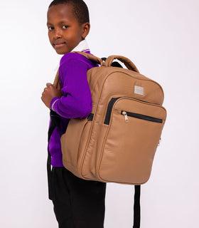 Denri Africa's beige Pioneer Backpack. Beige travel-ready backpack, padded back panel, large storage capacity.