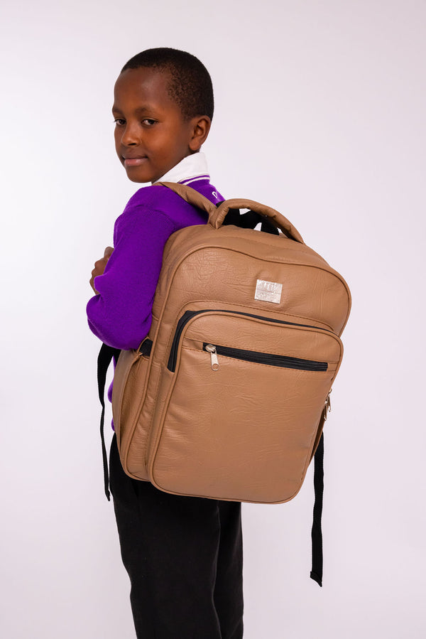 Denri Africa's beige Pioneer Backpack. Light beige school backpack, durable build, ideal for daily commute or travel.