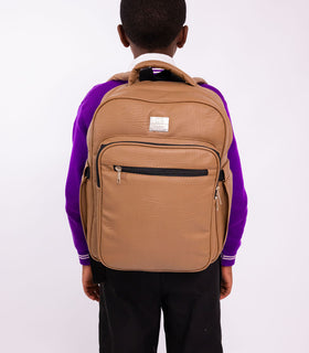 Denri Africa's beige Pioneer Backpack. Beige commuter backpack, roomy interior for books or devices, modern design.