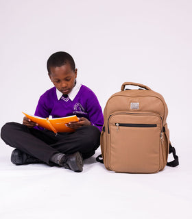 Denri Africa's beige Pioneer Backpack. Soft beige backpack, water-resistant fabric, casual everyday use.