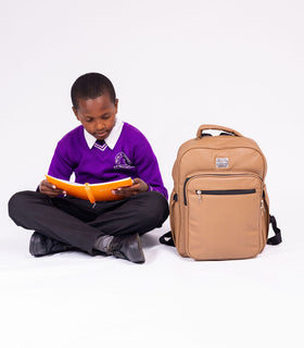 Denri Africa's beige Pioneer Backpack. Beige laptop backpack, padded straps and compartments, suitable for work or classes.