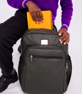 Denri Africa's green Pioneer Backpack. Olive-green school backpack, padded laptop sleeve, water-resistant fabric.