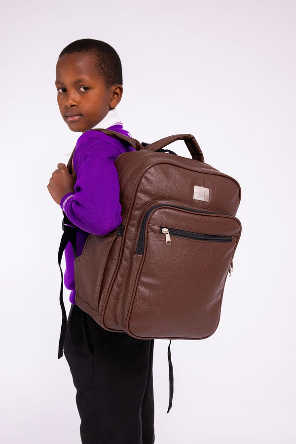Denri Africa's brown Pioneer Backpack. Brown school/travel backpack, sleek look, comfortable for long wear.