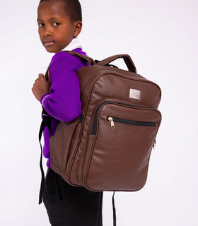 Denri Africa's brown Pioneer Backpack. Brown school/travel backpack, sleek look, comfortable for long wear.