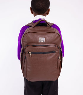 Denri Africa's brown Pioneer Backpack. Warm brown backpack, sturdy build, great for campus or work commute.