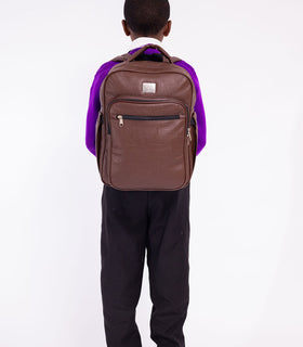 Denri Africa's brown Pioneer Backpack. Brown everyday backpack, organized storage for laptop and books.