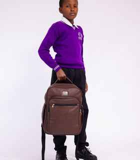 Denri Africa's brown Pioneer Backpack. Rich brown commuter backpack, padded back panel, spacious compartments.