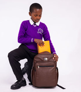 Denri Africa's brown Pioneer Backpack. Brown anti-theft backpack, large capacity front pockets, ideal for daily essentials.