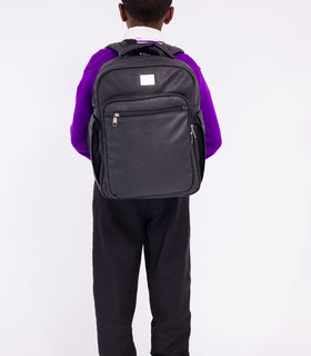 Denri Africa's black Pioneer Backpack. Black versatile backpack, secure compartments, great for work or school essentials.