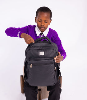 Denri Africa's black Pioneer Backpack. Black everyday backpack, water-resistant, ideal for school, work or travel.