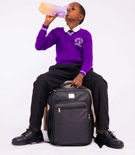 Denri Africa's black Pioneer Backpack. Classic black school backpack, anti-theft main compartment, ideal for daily commuting.