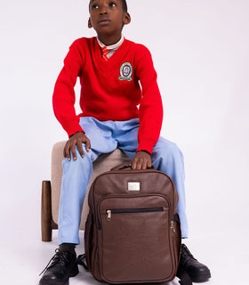 Denri Africa's brown Pioneer Backpack. Brown laptop-ready backpack, padded straps, secure document sleeve, perfect for work or school.