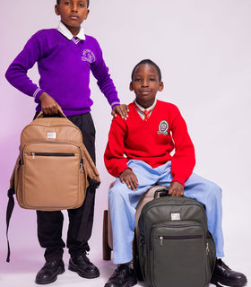 Denri Africa's beige and green Pioneer Backpack pair. Two-tone backpack set, contrasting colors, spacious compartments, vegan-leather style.
