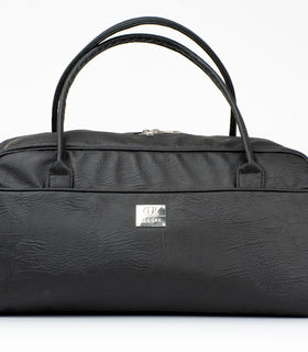 Denri Africa's black KAZ Travel Bag. Classic black travel duffle, durable vegan leather carry bag, perfect for business or leisure travel.