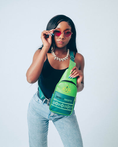 Denri Africa’s green Denri x Manyatta Crossbody Bag. Slim crossbody bag, deep green finish, practical hands-free carry for daily essentials.